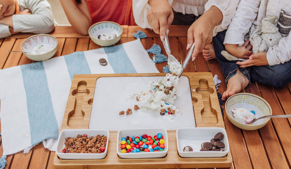 ice cream mixing station with kids and mom creating their own ice cream